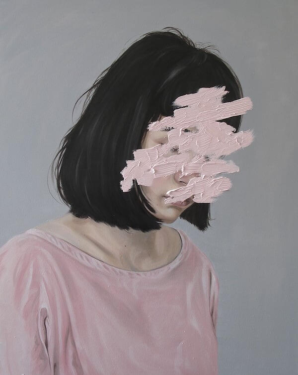 Portrait of a woman in a pale pink top, with pink brushstrokes obscuring her face against a gray background.